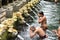 Male balinese having a ritual bath at Holy Spring Water