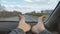 Male bare feet on the dashboard of a moving car. traffic on the motorway