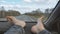 Male bare feet on the dashboard of a moving car. traffic on the motorway