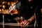 Male bartender pours alcohol cocktail with strainer