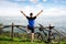 Male biker posing with raised hands