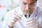 The male biochemist working in the lab on plants