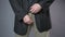 Male in black jacket pulling his pants zipper, embarrassment, man\'s health