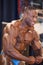 Male bodybuilder Michael Muzo shows his most muscular pose