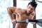 Male bodybuilder workout on parallel bars
