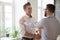 Male boss handshaking intern greeting with job promotion