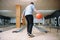 Male bowler standing on lane and poses with ball