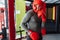 Male boxer engaged in training in the gym, in a cage for a fight without rules, Boxing coach