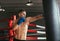 Male boxer hitting punching bag at a boxing studio