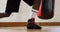 Male boxer tying shoelaces in fitness studio 4k