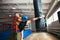 Male boxer workout high kick on the punching bag in gym