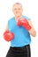 Male boxing coach holding guard