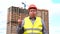 Male builder foreman, worker or architect on construction building site does not agree waving his finger.