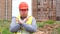 Male builder foreman, worker or architect on construction building site showing hand gesture stopping crossing his arms