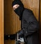 Male burglar stealing case