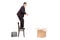 Male businessman prepared to jump in an empty box