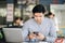 A male businessman is using the telephone to communicate with colleagues for financial planning and investment planning.