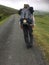 Male Camino pilgrim walking up the steep Pyrenees from St Jean.