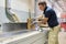 Male carpenter making wooden designer furniture for an individual private order