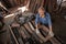 male carpenter uses sandpaper to polish the woodwork