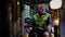 Male Caucasian forklift driver looking around at freight on racks in warehouse sitting in vehicle. Portrait of man