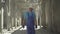 Male Caucasian inspector checking building site outdoors. Portrait of confident professional man walking along