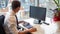 Male caucasian worker professional at his computer desk in an office in London, United Kingdom.