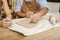 Male ceramist helping his colleague in making vase painting