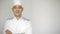 Male chef in a commercial kitchen standing on the white background