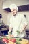 Male chef cook portrait cooking in the kitchen