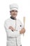 Male chef holding a spatula and smiling