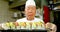 Male chef holding sushi tray in kitchen 4k