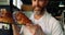 Male chef holding tray of croissants in bakery shop 4k