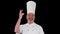 Male chef making real jam gesture to camera, Alpha Channel