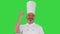 Male chef making real jam gesture to camera on a Green Screen, Chroma Key.