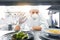 Male chef in mask with food at restaurant kitchen