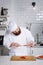 Male chef preparing gourmet meal of seafood in modern kitchen