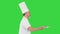 Male chef white uniform running with a plate of salad on a Green Screen, Chroma Key.