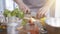 Male chief hands slicing cherry tomatoes on a wooden cutting board