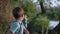 Male children running after each other on road by river