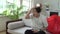 A male Chinese fan watches TV at home. Emotional sports fan with the flag of China