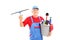 Male cleaner holding a bucket with cleaning supplies and looking