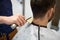 Male client and barber cleaning hair from neck