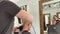 Male client getting haircut by hairdresser