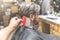 Male client and hairdresser cleaning neck with brush