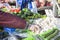 Male consumer at an open street market shopping fruit and vegetables. Street market. Helthy food.