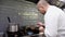 Male cook frying foie gras