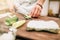 Male cook hands closeup, making sushi rolls