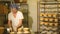 Male cook shaping dough for baking bread