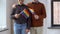 Male couple with gay pride rainbow flags at home